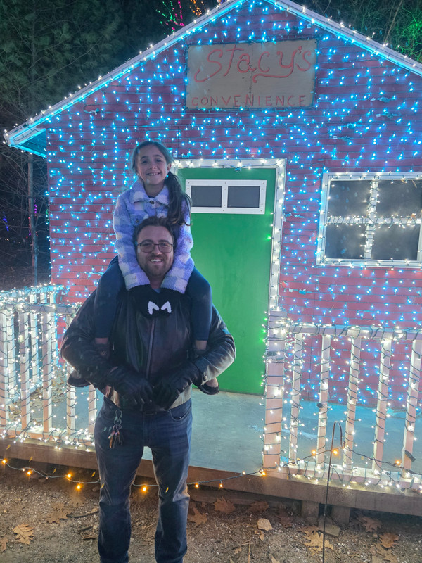 Victor with daughter at holiday lights