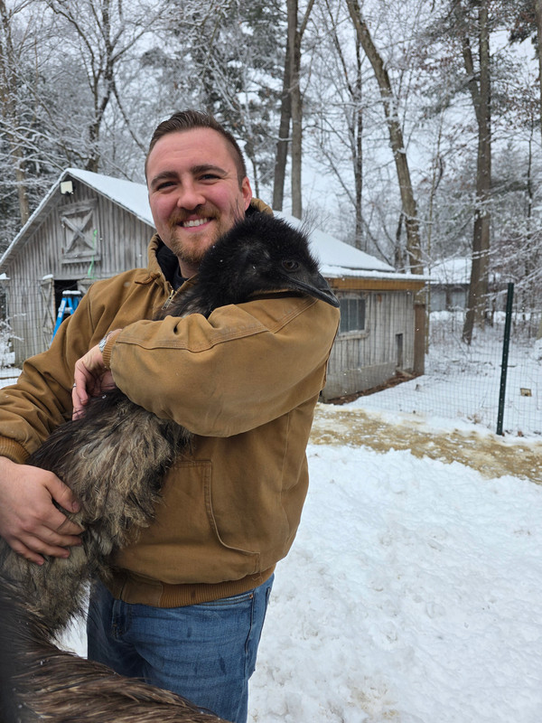 Victor holding an emu